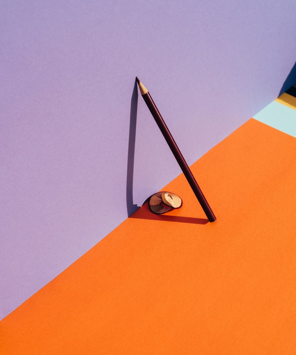 pencil-and-shavings-from-sharpening-leaning-on-the-violet-wall-.jpg